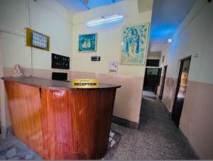 a room with a reception counter in a building at Gaurav Guest House in Mathura