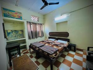 a bedroom with a bed in a room at Gaurav Guest House in Mathura