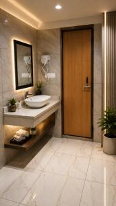 a bathroom with a sink and a wooden door at The Countryside Resorts Pahalgam in Pahalgām +15 photos