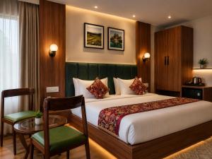 a hotel room with a bed and a table and a chair at The Countryside Resorts Pahalgam in Pahalgām