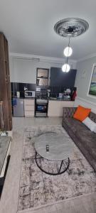 a living room with a couch and a coffee table at Dolphin Homestays in Nairobi +7 photos