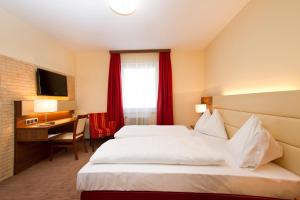 Posteľ alebo postele v izbe v ubytovaní SCHÖNIS-Landhotel