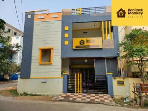 a building with the entrance to a building with yellow doors at Zapstays-Homestays in Visakhapatnam