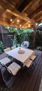 a patio with a table and chairs under a pergola at Costa Blanca Międzyzdroje - Holiday Home in Międzyzdroje