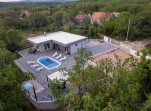 an aerial view of a house with a swimming pool at Villa Peace Oasis in Lovreć