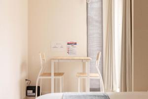Lova arba lovos apgyvendinimo įstaigoje Atsuta Good Place Hotel