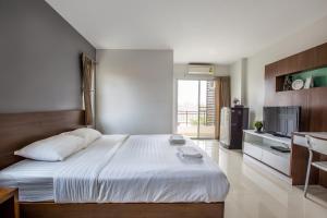 Ένα ή περισσότερα κρεβάτια σε δωμάτιο στο Central Place Serviced Apartment