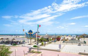 a view of a beach with the ocean in the background at Le Vele - Contro Fiocco in Rosolina