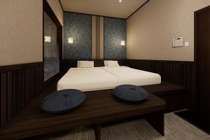 a rendering of a bedroom with a large bed at Ryokan Yufusan in Yufu