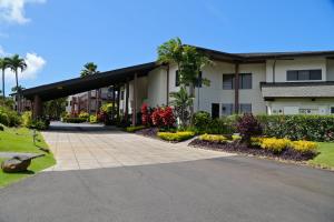 a building with a walkway in front of it at Ka Eo Kai Resort Studio Suite in Princeville +35 photos