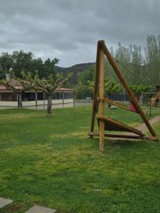 a playground with a swing set in a park at Casa Irlia in García