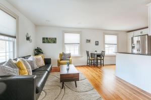 a living room with a couch and a table at Green on New in Staunton