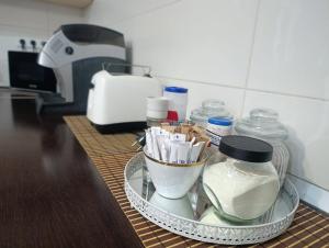 a counter with a tray of food and a mixer at Morrison Rezidence in Miercurea-Ciuc