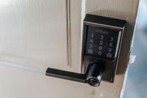 a lock on a door with a clock on it at Magnolia Suite in Staunton +19 photos