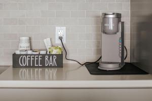 a coffee bar sign on a counter with a coffee maker at Mountain View Vista in Mount Torry Furnace +30 photos