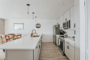 a kitchen with white cabinets and a white counter top at Mountain View Vista in Mount Torry Furnace