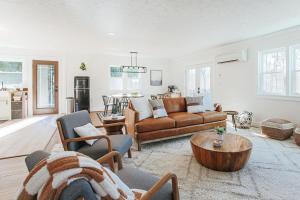 a living room with a couch and a table at Nelson Cozy Cabin in Nellysford