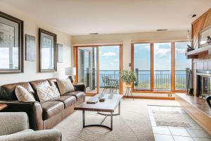a living room with a couch and a table at Panoramic Peak in Mount Torry Furnace +30 photos