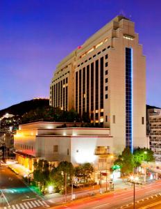 a large building with a street in front of it at THE GLOBAL VIEW Nagasaki in Nagasaki