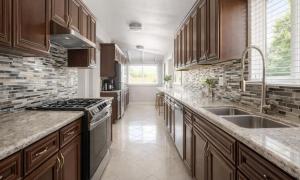 a kitchen with a sink and a stove top oven at Disneyland Dream Villa 5 BR 3 BA Arcade Games in Anaheim