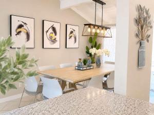 a dining room with a table and chairs at Disneyland Dream Villa 5 BR 3 BA Arcade Games in Anaheim