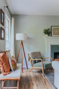a living room with a couch and a chair at Stuart Cottage in Staunton +45 photos