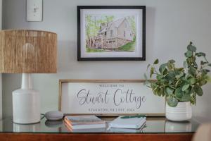a table with a picture of a house on it at Stuart Cottage in Staunton