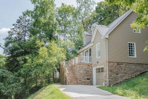 a brick house with a driveway in front of it at Stuart Cottage in Staunton