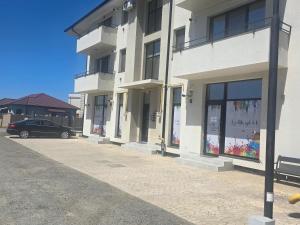 a car parked in front of a building at Marcus Residence Apartment in Satu Mare