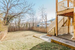 a house with a wooden staircase and a fence at The Hunker Down in Staunton