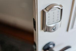 a close up of an alarm clock on a door at The Hunker Down in Staunton