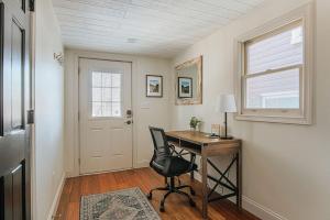 a home office with a desk and a chair at The Hunker Down in Staunton +32 photos