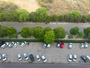 an aerial view of a parking lot with cars at Pindora Stays in Ludhiana