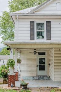 a white house with a door and a window at The Wayne Shire in Waynesboro +50 photos