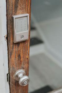 a close up of a wooden door with a lock at The Social Loft in Staunton +28 photos