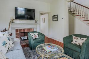 a living room with two chairs and a fireplace at The Woodward in Staunton +65 photos