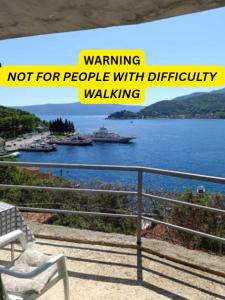 a sign that sayswarning not for people with difficulty walking at Apartments Eftimov in Tivat