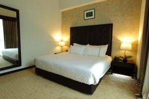 Katil atau katil-katil dalam bilik di Symphony Suites Hotel