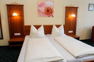Postel nebo postele na pokoji v ubytování Hotel Posauner