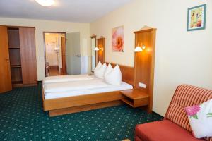 Postel nebo postele na pokoji v ubytování Hotel Posauner + 37 fotografií