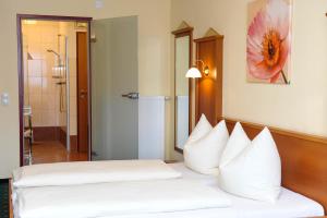Postel nebo postele na pokoji v ubytování Hotel Posauner