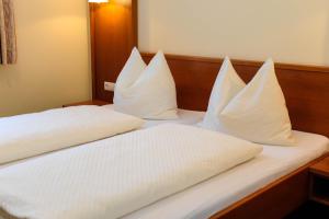 Postel nebo postele na pokoji v ubytování Hotel Posauner