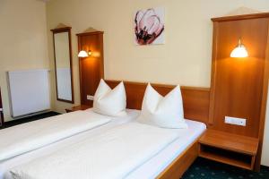Postel nebo postele na pokoji v ubytování Hotel Posauner