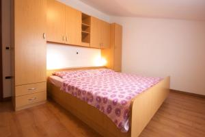 Postel nebo postele na pokoji v ubytování Apartments AVA