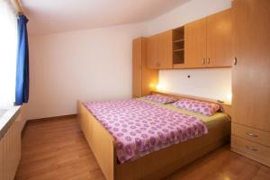 Postel nebo postele na pokoji v ubytování Apartments AVA