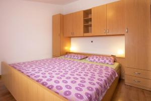 Postel nebo postele na pokoji v ubytování Apartments AVA