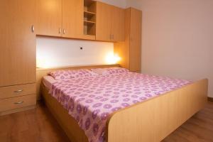 Postel nebo postele na pokoji v ubytování Apartments AVA