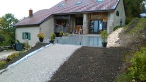 a house with a driveway in front of it at La Grange De L'Errance in Giron