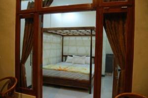 Postel nebo postele na pokoji v ubytování Aditya Homestay