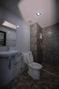 a bathroom with a toilet and a sink at Sixty-Sixplace in Ban Khok Lo +22 photos